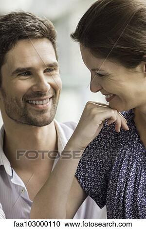 Couple smiling together at home View Large Photo Image Stock Image - Couple smiling together at home. Fotosearch