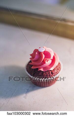 Cupcake decorated with pink frosting View Large Photo Image Stock Image - Cupcake decorated with pink frosting. Fotosearch