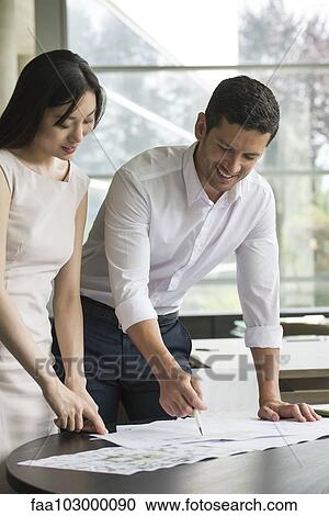Stock Image - Designers collaborating. Fotosearch