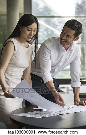 Engineers working on design together View Large Photo Image Stock Image - Engineers working on design together. Fotosearch