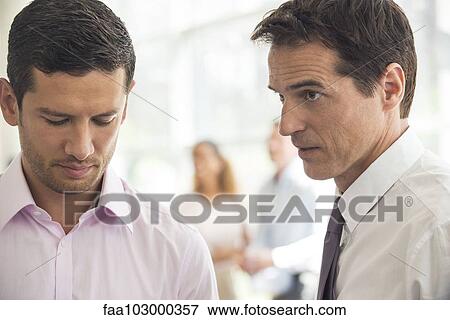 Executive having difficult talk with employee View Large Photo Image Stock Photo - Executive having difficult talk with employee. Fotosearch