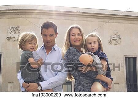 Stock Photo - "Family together outdoors, portrait". Fotosearch