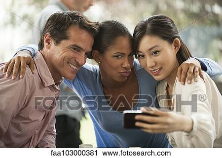 Friends posing for selfie in cafe View Large Photo Image Stock Image - Friends posing for selfie in cafe. Fotosearch