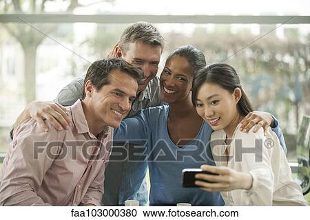 Friends posing together for selfie View Large Photo Image Stock Image - Friends posing together for selfie. Fotosearch