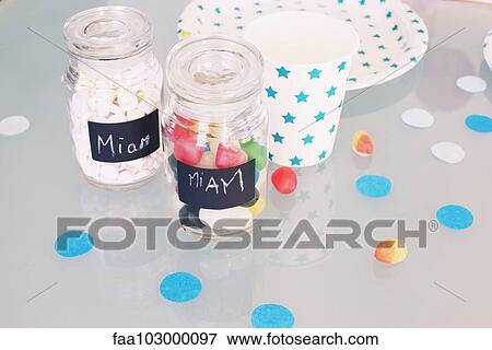 Jars of candy and party accessories View Large Photo Image Stock Photo - Jars of candy and party accessories. Fotosearch
