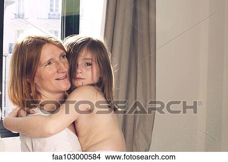Little girl embracing her mother View Large Photo Image Picture - Little girl embracing her mother. Fotosearch