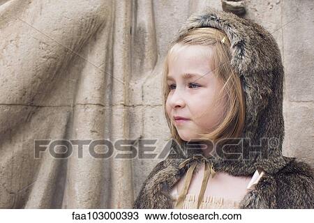 "Little girl wearing hooded fur cloak outdoors, portrait" View Large Photo Image Stock Image - "Little girl wearing hooded fur cloak outdoors, portrait". Fotosearch