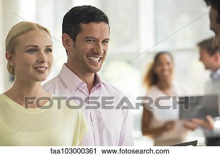 Man and woman listening to salesman View Large Photo Image Stock Image - Man and woman listening to salesman. Fotosearch