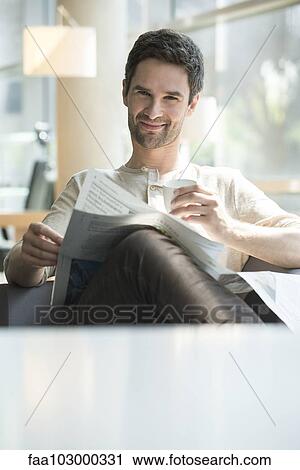 Man relaxing with coffee and newspaper View Large Photo Image Stock Image - Man relaxing with coffee and newspaper. Fotosearch