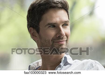 "Man smiling contentedly, portrait" View Large Photo Image Stock Image - "Man smiling contentedly, portrait". Fotosearch