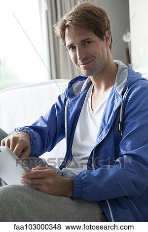 Man using digital tablet View Large Photo Image Stock Photo - Man using digital tablet. Fotosearch