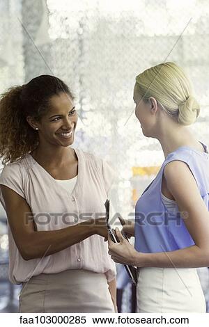 Officer worker welcoming new employee View Large Photo Image Stock Photography - Officer worker welcoming new employee. Fotosearch