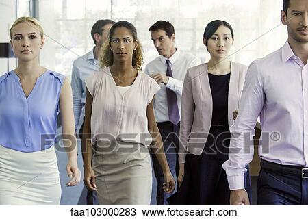 Stock Image - Officer workers marching in unison. Fotosearch