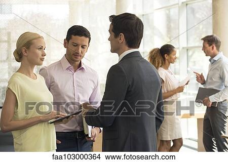 Salesman meeting with clients View Large Photo Image Picture - Salesman meeting with clients. Fotosearch