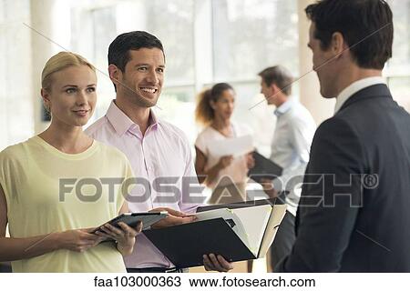 Salesman meeting with clients View Large Photo Image Stock Image - Salesman meeting with clients. Fotosearch