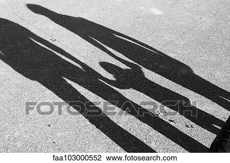Shadow of parents and child holding hands View Large Photo Image Stock Image - Shadow of parents and child holding hands. Fotosearch