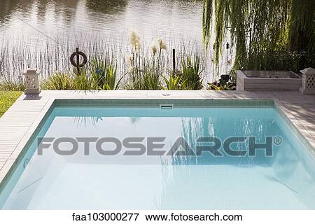 Swimming pool on edge of lake View Large Photo Image Stock Photo - Swimming pool on edge of lake. Fotosearch
