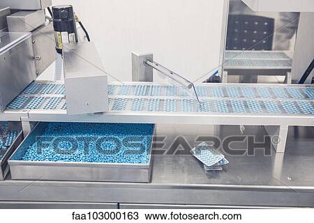 Tablet trays on conveyor belt entering blisterpack sealing machine View Large Photo Image Stock Image - Tablet trays on conveyor belt entering blisterpack sealing machine. Fotosearch