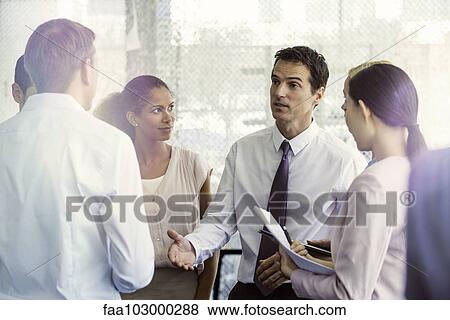 Team members receive direction from supervisor View Large Photo Image Stock Photo - Team members receive direction from supervisor. Fotosearch