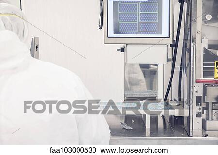Technician working in prescription drug production facility View Large Photo Image Stock Image - Technician working in prescription drug production facility. Fotosearch