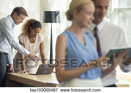 Wireless devices make collaboration in business easy View Large Photo Image Stock Photo - Wireless devices make collaboration in business easy. Fotosearch