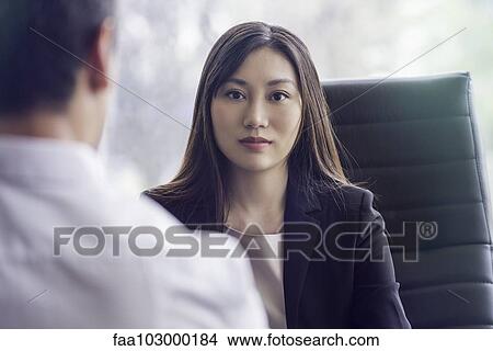 Picture - Woman at job interview. Fotosearch