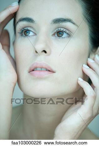 "Woman, hands on sides of face, portrait" View Large Photo Image Stock Photograph - "Woman, hands on sides of face, portrait". Fotosearch
