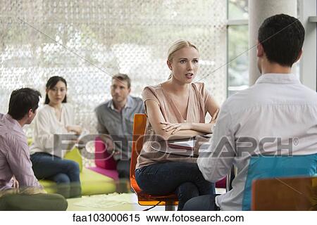 Woman having casual meeting with colleague View Large Photo Image Stock Photography - Woman having casual meeting with colleague. Fotosearch