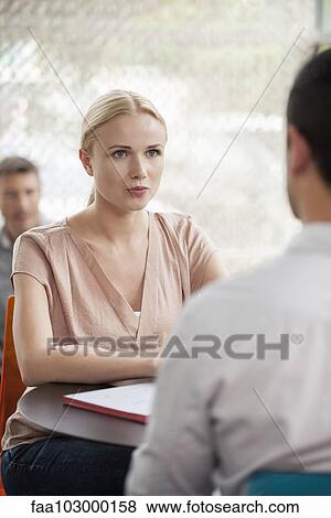 Stock Photo - Woman having informal meeting with colleague. Fotosearch