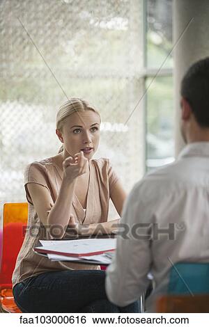 Woman having informal meeting with colleague in cafe View Large Photo Image Stock Photograph - Woman having informal meeting with colleague in cafe. Fotosearch