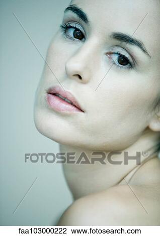 "Woman looking over shoulder, portrait" View Large Photo Image Stock Image - "Woman looking over shoulder, portrait". Fotosearch