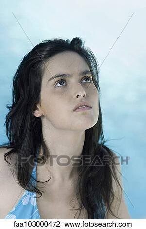 "Woman looking up, portrait" View Large Photo Image Stock Image - "Woman looking up, portrait". Fotosearch