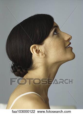 "Woman looking up, smiling, profile" View Large Photo Image Stock Image - "Woman looking up, smiling, profile". Fotosearch