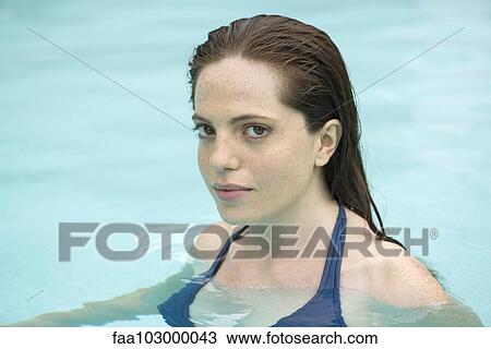 "Woman relaxing in pool, portrait" View Large Photo Image Stock Image - "Woman relaxing in pool, portrait". Fotosearch