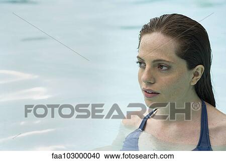 Woman relaxing in swimming pool View Large Photo Image Stock Image - Woman relaxing in swimming pool. Fotosearch