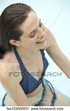 Woman relaxing in swimming pool View Large Photo Image Stock Photo - Woman relaxing in swimming pool. Fotosearch