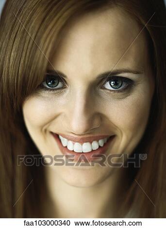 "Woman smiling at camera, portrait" View Large Photo Image Stock Image - "Woman smiling at camera, portrait". Fotosearch