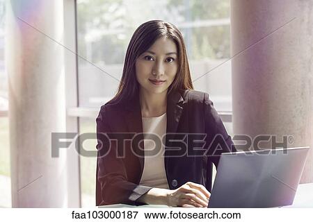 Woman using laptop computer View Large Photo Image Stock Photo - Woman using laptop computer. Fotosearch