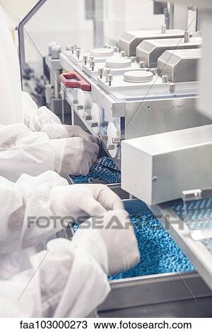 Worker monitoring pill packaging machinery View Large Photo Image Stock Image - Worker monitoring pill packaging machinery. Fotosearch