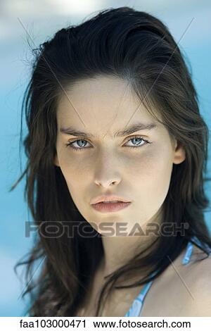 "Young woman staring at camera, portrait" View Large Photo Image Stock Image - "Young woman staring at camera, portrait". Fotosearch