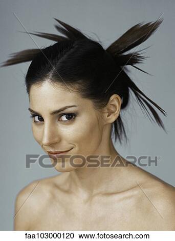 "Young woman with spiky hairstyle, portrait" View Large Photo Image Stock Image - "Young woman with spiky hairstyle, portrait". Fotosearch