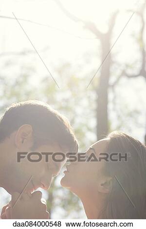 Affectionate couple outdoors View Large Photo Image Stock Photo - Affectionate couple outdoors. Fotosearch