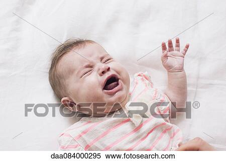 Stock Photography - Baby crying. Fotosearch