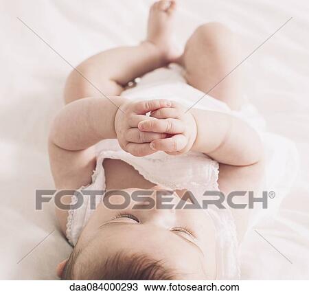 Baby lying on back View Large Photo Image Stock Image - Baby lying on back. Fotosearch