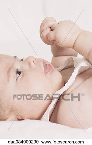 Baby playing with hands View Large Photo Image Stock Image - Baby playing with hands. Fotosearch
