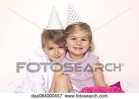 Children wearing party hats, portrait View Large Photo Image Stock Photo - Children wearing party hats, portrait. Fotosearch