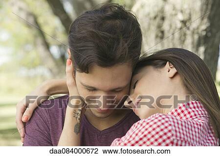 Couple embracing outdoors View Large Photo Image Stock Image - Couple embracing outdoors. Fotosearch