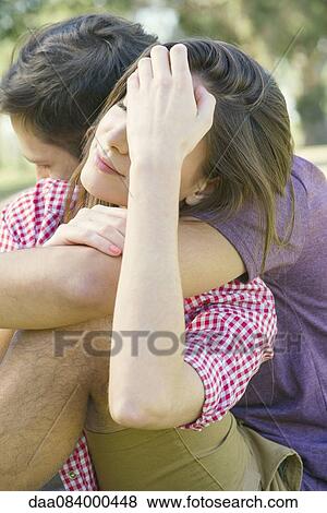 Stock Photo - Couple embracing outdoors. Fotosearch