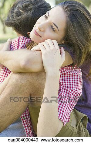 Couple embracing outdoors View Large Photo Image Stock Photo - Couple embracing outdoors. Fotosearch