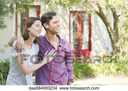 Couple smiling together outdoors View Large Photo Image Picture - Couple smiling together outdoors. Fotosearch